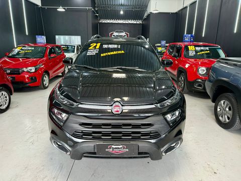 fiattoro freedom 18 flex automatica 2021 carro sao bernardo do campo sp a fiat toro freedom vem equipada com um motor 18 de 139cv com 193kgfm de torque e um cambio automatico de 6 marchas trazendo economia potencia e conforto para voce e sua familia possui direcao eletrica ar condicionado bancos em tecido vidros eletricos travas eletricas retrovisores eletricos multimidia com apple carplay android auto camera de re conexao bluetooth e usb sensores traseiros rodas de liga leve aro 16 e uma cacamba de 820l de capacidade acompanha os 4 pneus novos ipva totalmente pago polimento e higienizacao completa vai financiar temos varios bancos em parceria faca sua simulacao online one motors certeza do melhor negocio entre em contato com um de nossos consultores adrianarodrigo nos reservamos no direito de corrigir qualquer tipo de erro de digitacao carro sao bernardo do campo sp fiat toro 2021 flex automatico pickup 53287 preto 4 portas alarme ar condicionado banco com regulagem de altura computador de bordo retrovisores eletricos volante com regulagem de altura gps airbag freio abs ar quente travas eletricas vidros eletricos direcao hidraulica rodas liga leve